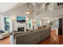 Bright living room with a high ceiling, fireplace, and hardwood floors that create a cozy atmosphere at 4969 Royal Adelaide Way, Raleigh, NC 27604