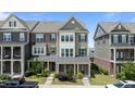 Charming townhome with landscaped front yard and covered porch, perfect for relaxing outdoors at 520 Austin View Blvd, Wake Forest, NC 27587