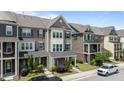 Attractive townhome exteriors, complemented by neat landscaping and street appeal at 520 Austin View Blvd, Wake Forest, NC 27587