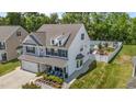 A beautiful two-story home with backyard pool, and a cozy front porch with outdoor seating at 528 Brycewood Dr, Burlington, NC 27215