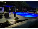 Backyard pool with an adjacent gazebo, lush landscaping and a playset in the background at 528 Brycewood Dr, Burlington, NC 27215