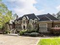 Beautiful brick home boasts manicured landscaping and inviting curb appeal at 5420 Deer Forest Trl, Raleigh, NC 27614