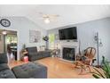 Inviting living room with a cozy fireplace and natural light at 604 Sinewell Dr, Wake Forest, NC 27587