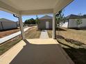 Covered back porch offering a serene view of the surrounding new construction neighborhood at 773 Portland Rose Dr, Knightdale, NC 27545
