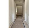 A clean and bright hallway showcasing decorative wall trim and new hardwood floors at 79 Mildred Dr, Broadway, NC 27505