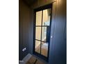 Stylish front door with glass panes providing a glimpse into the home's interior at 833 Dunleigh Dr, Burlington, NC 27215