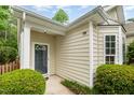 Inviting entryway with a stylish front door and manicured landscaping at 8437 Whisper Ridge Pl, Raleigh, NC 27613