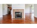 Close up on fireplace, features tile surround, hearth, and a white mantle at 95 Lockhaven Ct, Cameron, NC 28326