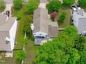 Aerial view of a well-maintained property, including a gazebo, lawn, and mature trees at 104 Harvolly Dr, Holly Springs, NC 27540
