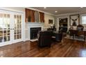 Bright living room boasting hardwood floors, fireplace, and French doors at 107 Forest Rd, Oxford, NC 27565
