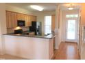 Bright kitchen featuring light wood cabinets, stainless steel appliances, and an open layout perfect for entertaining at 113 Conner Dv # 106, Chapel Hill, NC 27514