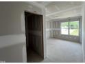 Bedroom ready for customization featuring a large window at 183 Pecan Valley Way, Four Oaks, NC 27524