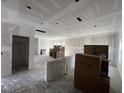 Spacious living room features ample lighting and is ready for new finishes at 183 Pecan Valley Way, Four Oaks, NC 27524