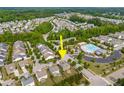 Aerial view showing neighborhood amenities of the green home including a pool and playground at 364 Springtime Fields Ln, Wake Forest, NC 27587