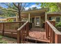 Charming brick home with a cozy front porch and stone accents, perfect for relaxing and enjoying the neighborhood views at 424 Raleigh View Rd, Raleigh, NC 27610