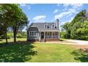 Charming single-Gathering home features a welcoming front porch and well-maintained lawn at 5337 Nc Hwy 96, Selma, NC 27576