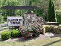 Hayesbury Townes community sign surrounded by landscaping and greenery at 6341 Grace Lily Dr, Raleigh, NC 27607