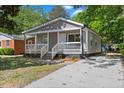 Attractive gray home with a cozy front porch and a freshly paved driveway at 806 Martin Luther King Jr Dr, Smithfield, NC 27577