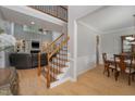 Open-concept foyer flows into the living room and dining area, showcasing the staircase at 1003 Red Sunset Dr, Apex, NC 27502