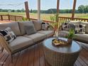 Relaxing deck area with comfortable seating and a scenic view of the surrounding countryside at 106 Contender Dr, Clayton, NC 27520