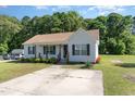 Attractive single-story home with landscaped front yard, sidewalk, and covered entryway at 116 Meade Dr, Four Oaks, NC 27524