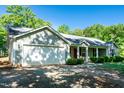 Charming one-story home with an attached garage and covered entry at 116 Shawnee Dr, Louisburg, NC 27549