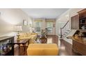 Inviting living room with hardwood floors, staircase, and view of the front door at 1204 Caribou Xing, Durham, NC 27713