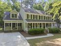 Lovely home with a spacious front porch, offering a cozy and inviting curb appeal at 128 Cobblestone Dr, Chapel Hill, NC 27516
