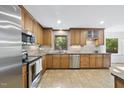 Well-equipped kitchen with stainless steel appliances and granite countertops at 128 Cobblestone Dr, Chapel Hill, NC 27516