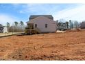 New two-story home with board and batten siding and a wooden deck overlooking the backyard at 1403 Reading Ct # 75 Kl, Burlington, NC 27217
