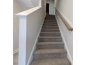 Carpeted staircase featuring neutral walls with white trim at 1590 Pecan Drive # 45, Nashville, NC 27856