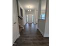 Inviting foyer boasts wood flooring, with staircase and front door with sidelights visible at 1640 Pecan Drive # 44, Nashville, NC 27856