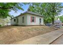 Charming single-story home featuring a ramp for accessibility and red window trim at 1701 Sunset St, Roxboro, NC 27573