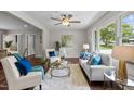 Cozy living room featuring comfortable seating, stylish decor, and a large window offering natural light at 1734 Stage Rd, Durham, NC 27703