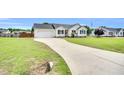 Single-story home featuring an attached garage and a long driveway leading to the residence at 182 Jesse Dr, Smithfield, NC 27577