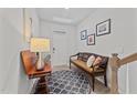 Cozy entryway featuring a wooden bench, decorative rug, and neutral wall colors at 191 Enterprise Dr, Clayton, NC 27520