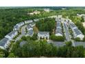 An aerial view showcasing the neighborhood's layout, mature trees, and well-maintained surroundings at 2713 Wyntercrest Ln, Durham, NC 27713