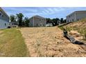 View of the backyard showing the size of the lot and neighboring homes at 332 Bishop Ln, Sanford, NC 27330