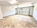 Spacious two car garage with a high ceiling and an automatic garage door opener at 332 Bishop Ln, Sanford, NC 27330