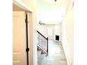 Hallway view of the living room with a fireplace and staircase at 332 Bishop Ln, Sanford, NC 27330