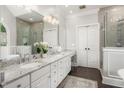 Elegant bathroom featuring double vanities, granite countertops, and stylish tile at 3440 Black Bear Cv, Burlington, NC 27215