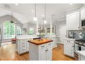 Bright kitchen featuring a central island, stainless appliances, and an open layout at 3440 Black Bear Cv, Burlington, NC 27215