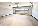 Clean two car garage with white door and plenty of space for parking and storage at 356 Bishop Ln, Sanford, NC 27330