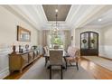 Elegant dining room boasts coffered ceilings and natural light at 5009 Coe Hill Pl, Cary, NC 27519