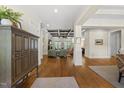 Spacious living room with hardwood floors, coffered ceilings, and bright, open design at 5009 Coe Hill Pl, Cary, NC 27519