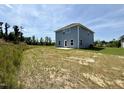 Spacious backyard featuring a new construction home, perfect for outdoor activities and future landscaping projects at 538 Middleton Ct, Sanford, NC 27330