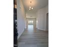 Inviting entryway with modern light fixture and beautiful hard surface floors at 600 Sweet Potato Lane # 38, Nashville, NC 27856
