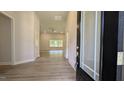 Bright living room featuring wood-look flooring, large windows, and neutral paint at 600 Sweet Potato Lane # 38, Nashville, NC 27856
