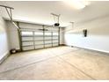 Spacious two-car garage featuring an automatic door opener and ample room for vehicles at 606 Melrose Ct, Sanford, NC 27330