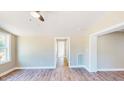 Bright living room featuring new, light-colored flooring and neutral walls, creating a serene and inviting space at 6715 Princeton Kenly Rd, Princeton, NC 27569